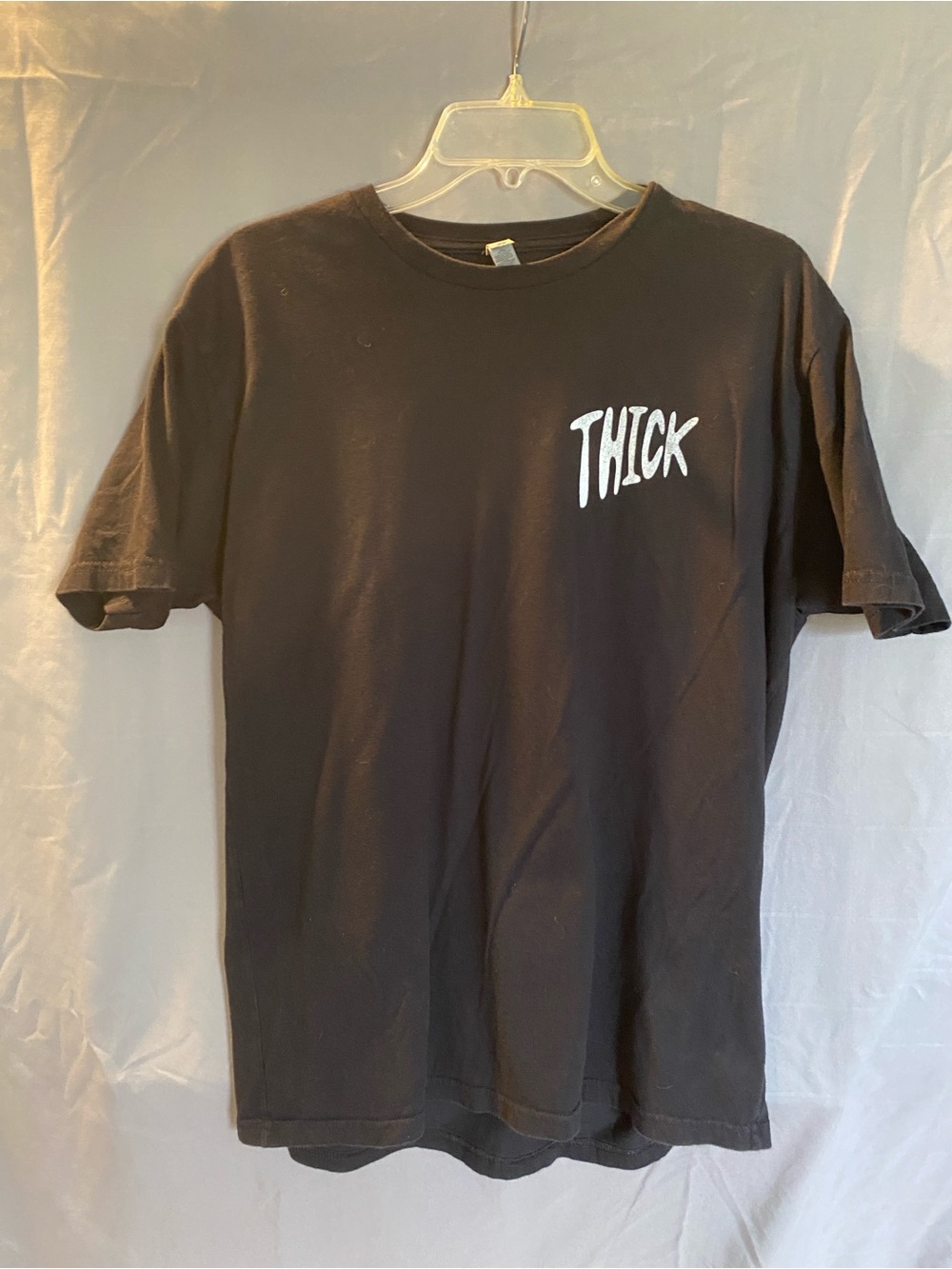 Next Level Apparel Black Short Sleeve Tee with White "THICK" Chest Graphic